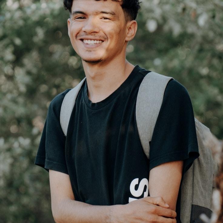 Kaveri Mehta, Lead Design Curator at Pocket Stone Market, reviewing corporate floral arrangements